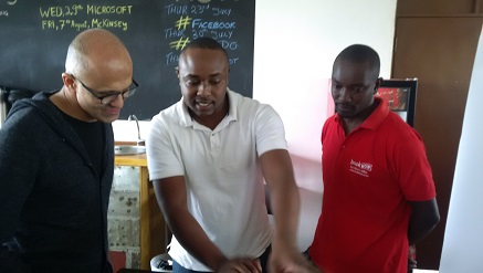 (L-r): Satya‎ Narayana Nadella, Microsoft Corporation CEO, Satya‎ Narayana Nadella, Francis Gesora, CEO of BookNow and Michael Nguru, chief technology officer, BookNow, during Microsoft's inspection tour on technology startups at Microsoft incubation hub, being part of activities marking the launch of Windows 10 in Kenya on Wednesday.